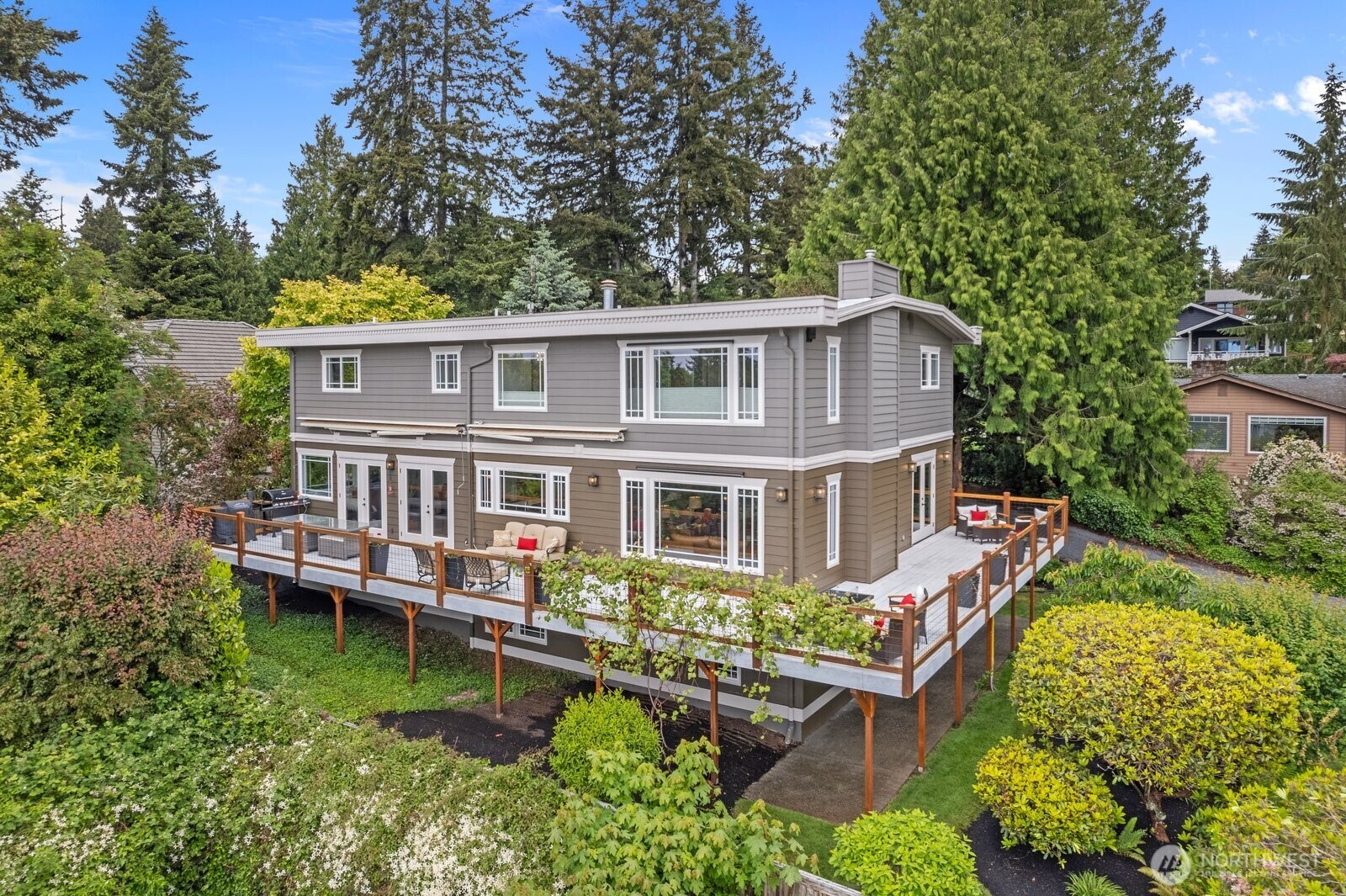 11404 239th Place Southwest Woodway, WA 98020 - Photo 2 of 40 front view of a house with a yard table and chairs