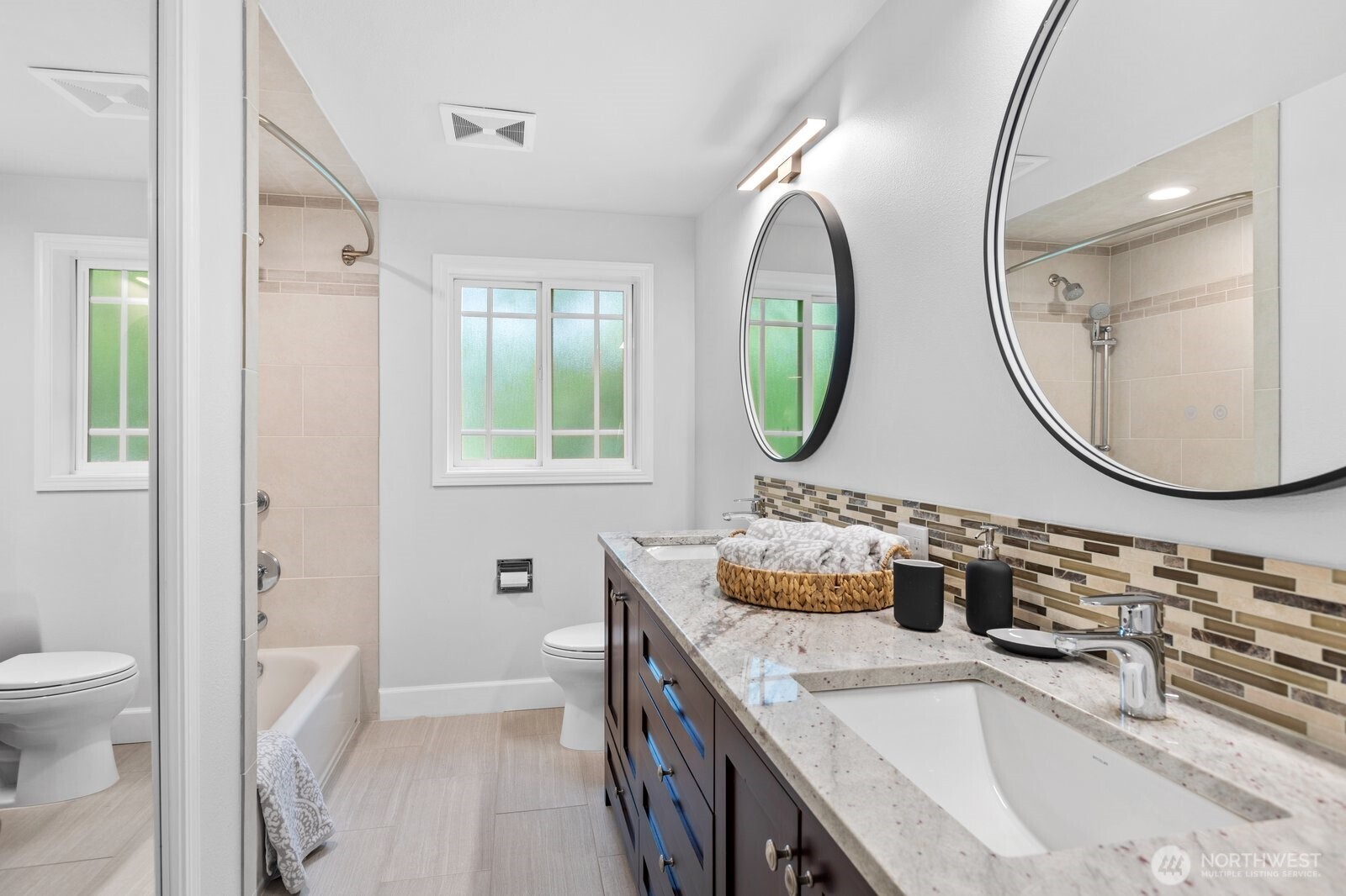 11404 239th Place Southwest Woodway, WA 98020 - Photo 25 of 40 a bathroom with a granite countertop sink mirror and toilet