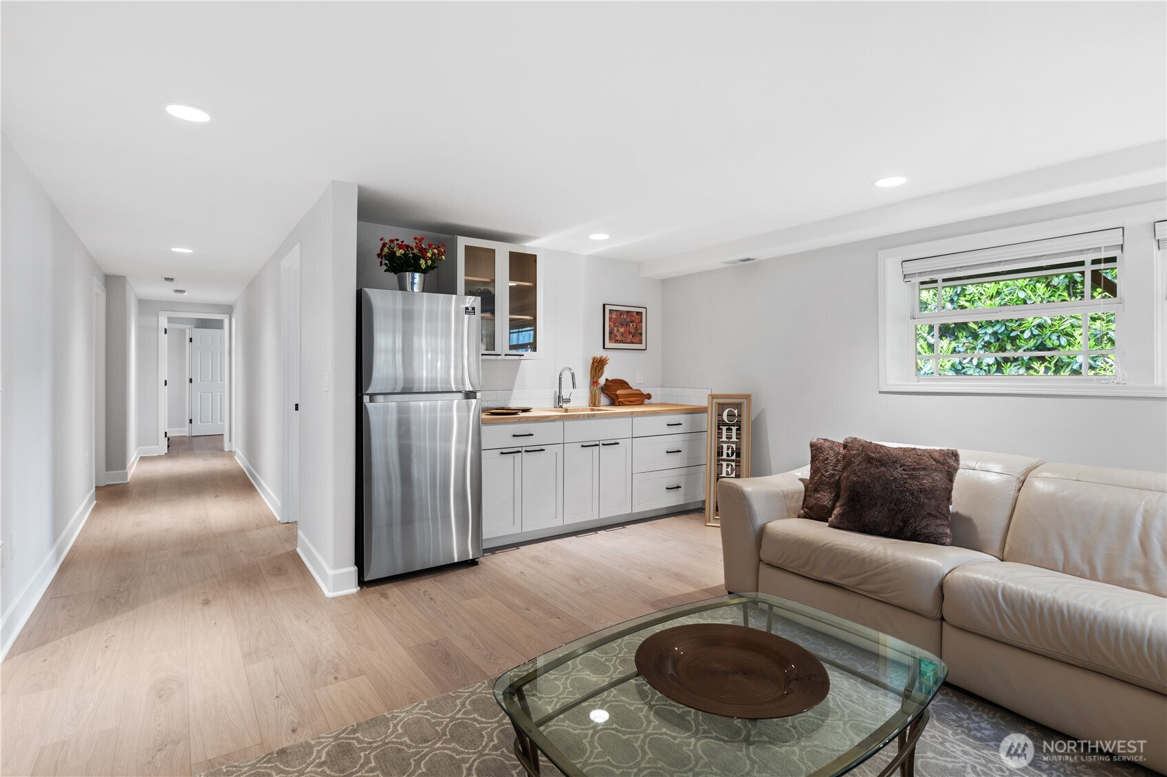 11404 239th Place Southwest Woodway, WA 98020 - Photo 27 of 40 a living room with furniture and a rug