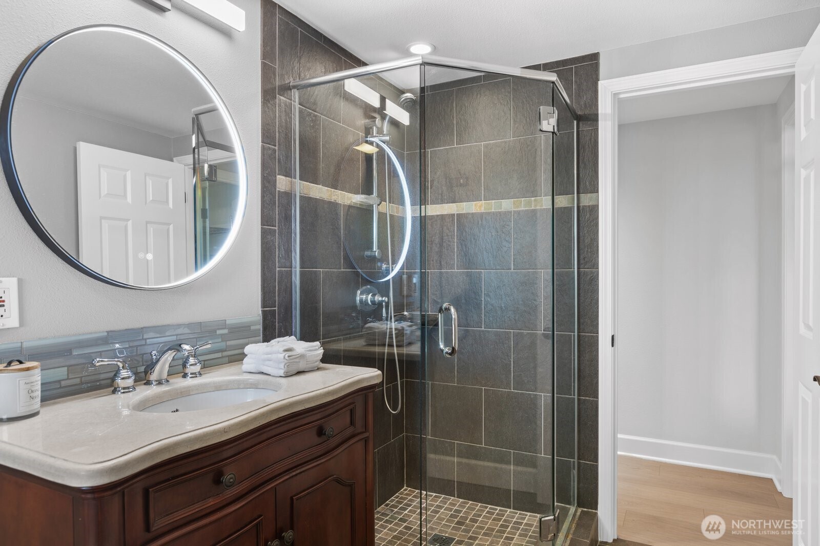11404 239th Place Southwest Woodway, WA 98020 - Photo 28 of 40 a bathroom with a sink vanity granite and a mirror