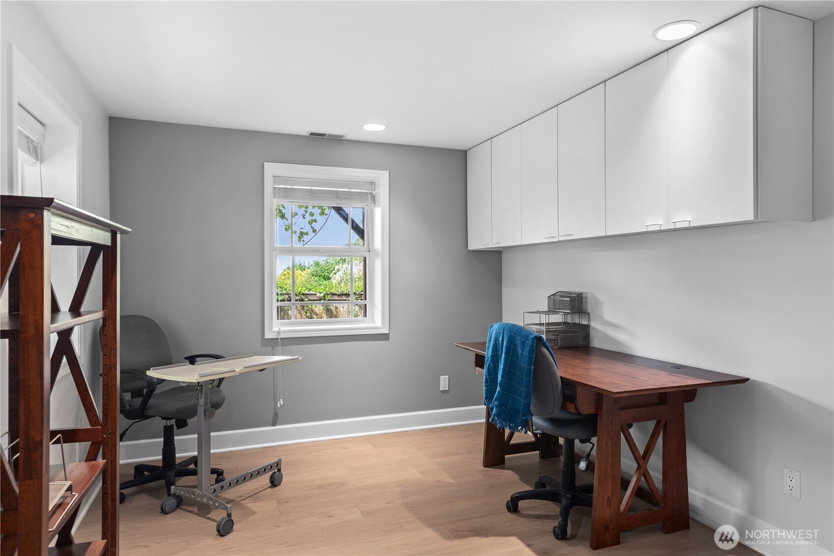 11404 239th Place Southwest Woodway, WA 98020 - Photo 30 of 40 a view of a workspace with furniture and a window