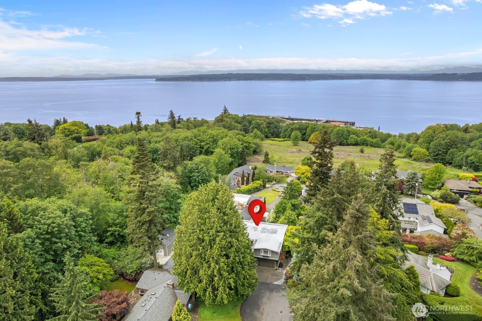 11404 239th Place Southwest Woodway, WA 98020 - Photo 3 of 40 an aerial view of a houses with a lush green forest