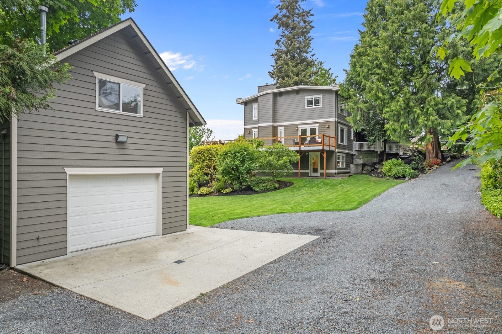 11404 239th Place Southwest Woodway, WA 98020 - Photo 32 of 40 a view of a house with a yard and garage