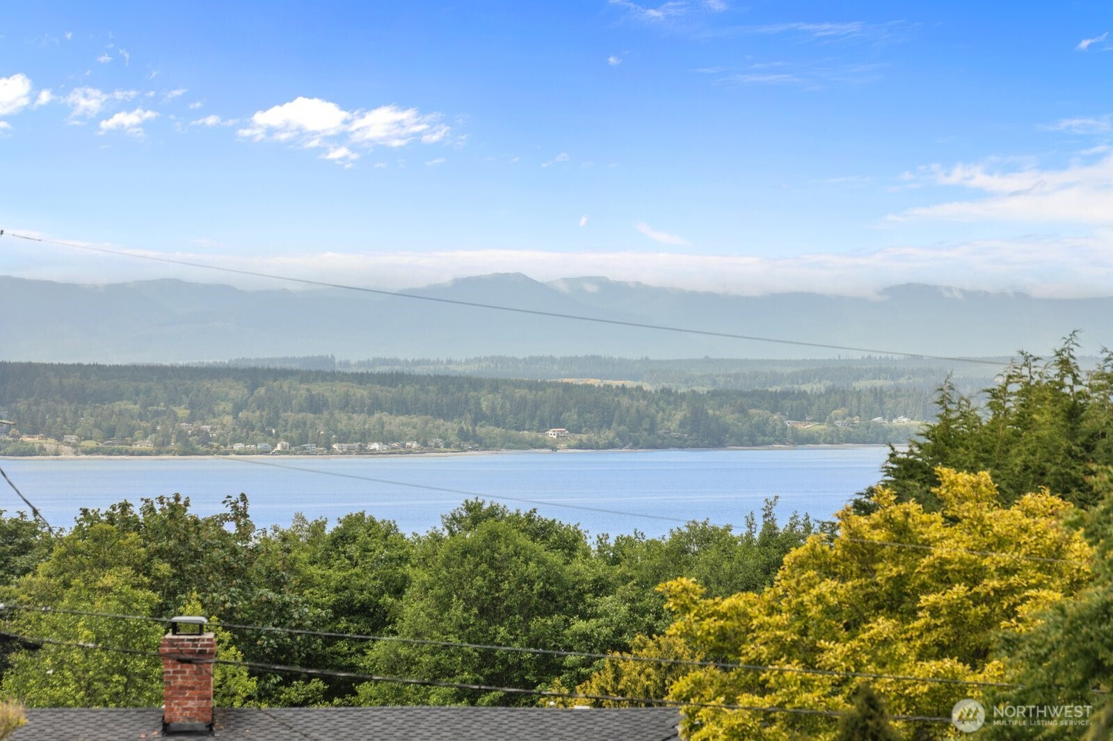 11404 239th Place Southwest Woodway, WA 98020 - Photo 4 of 40 a view of a lake with sunset in background