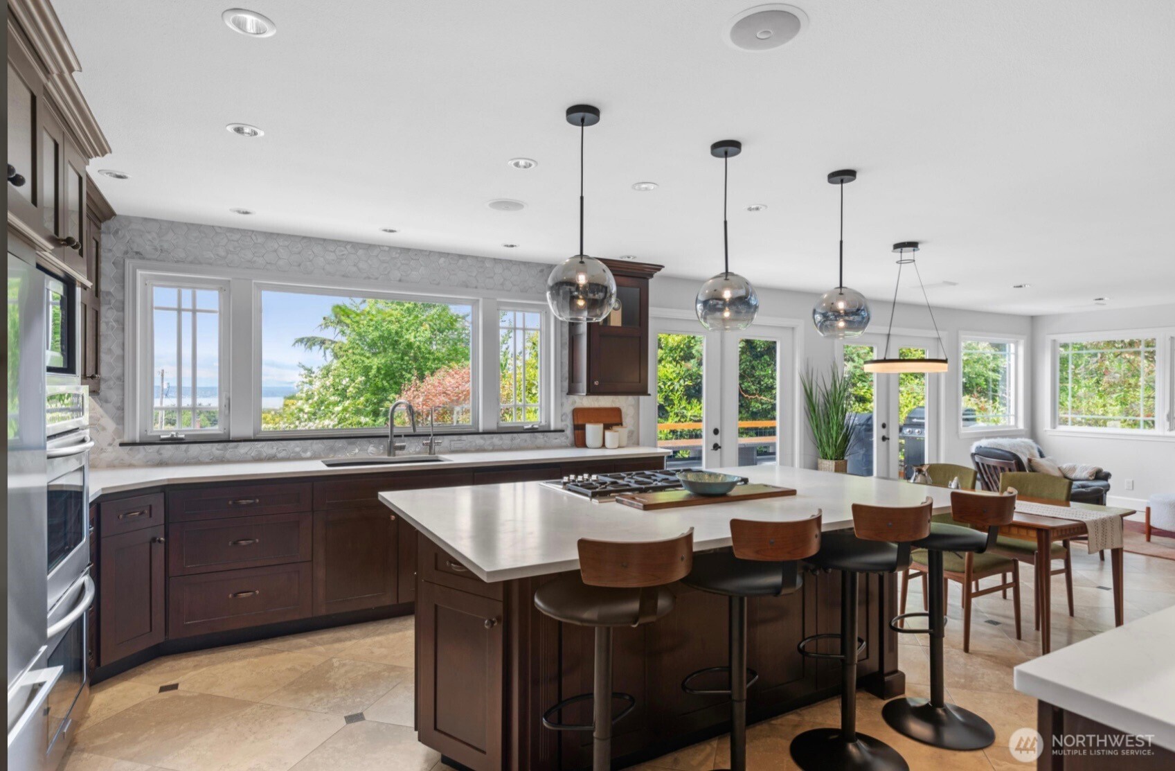 11404 239th Place Southwest Woodway, WA 98020 - Photo 6 of 40 a view of a dining table chairs and chandelier