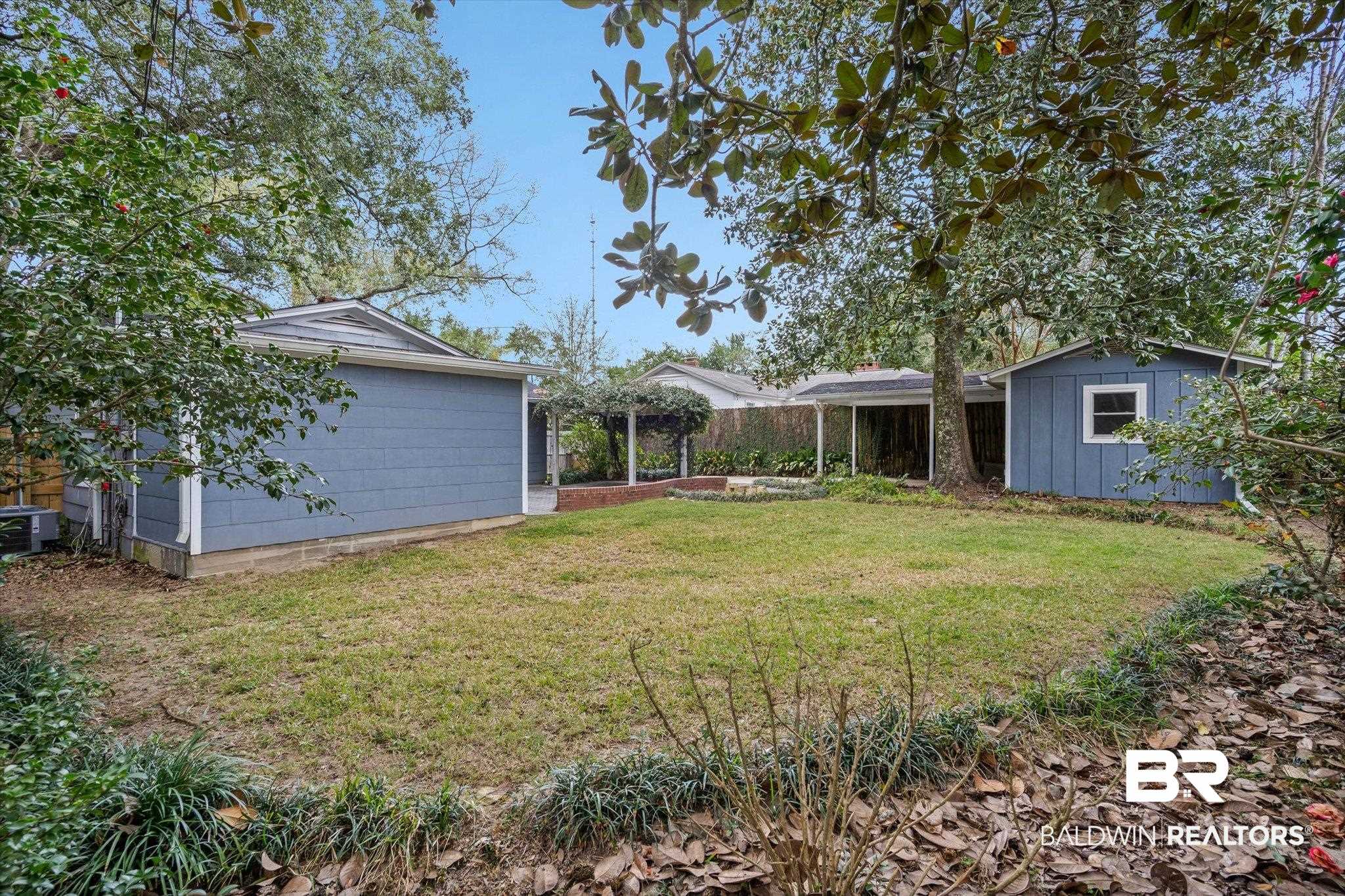 11 York Place Mobile, AL 36608 - Photo 21 of 24 View of green lawn featuring a storage unit