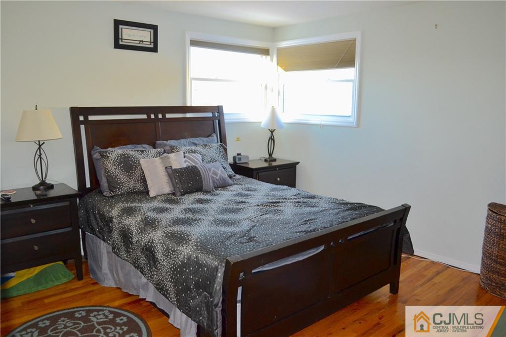 51 Eardley Road Edison, NJ 08817 - Photo 11 of 22 a bed sitting in a bedroom next to a window
