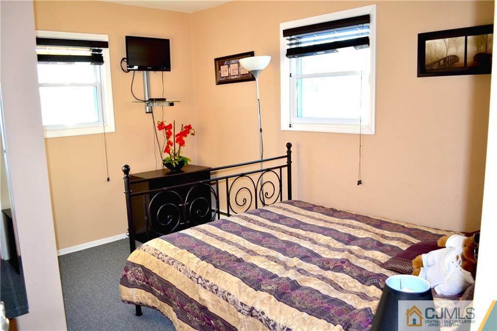 51 Eardley Road Edison, NJ 08817 - Photo 14 of 22 a bedroom with a bed and a window