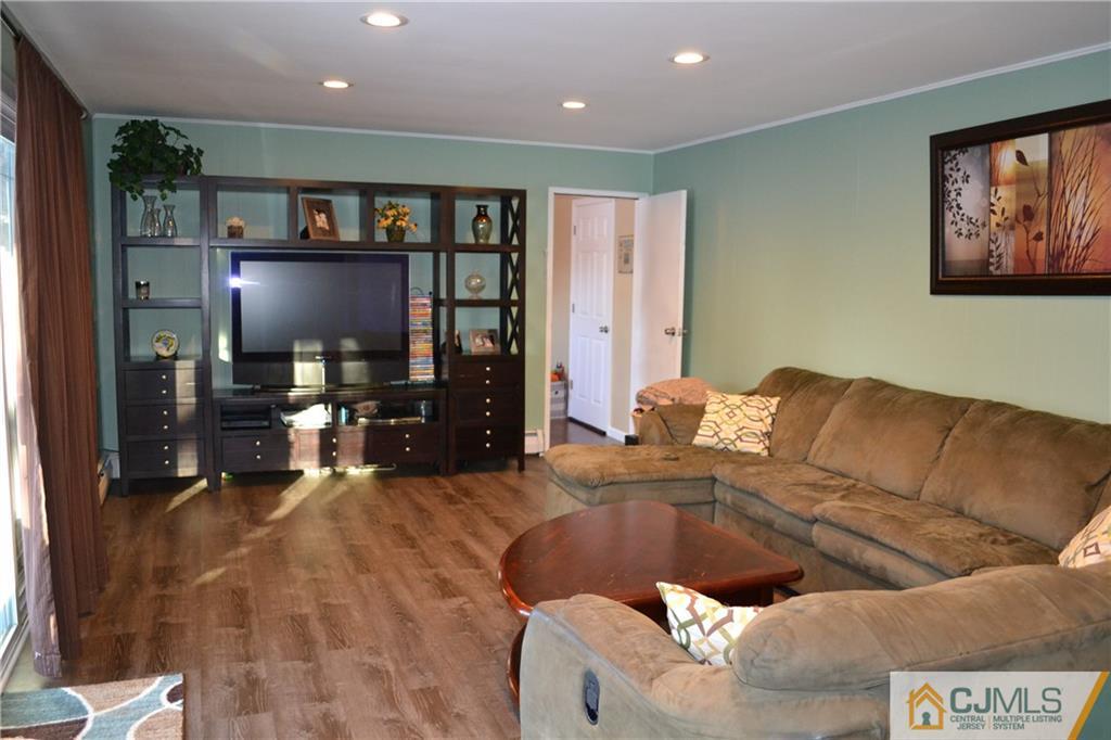 51 Eardley Road Edison, NJ 08817 - Photo 16 of 22 a living room with furniture and kitchen view