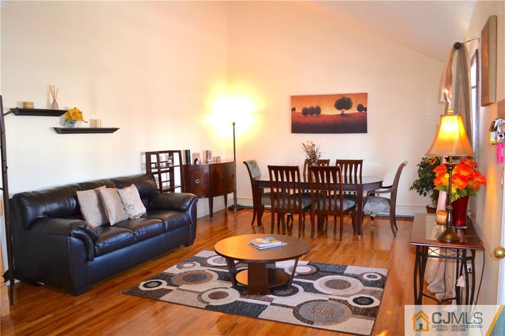 51 Eardley Road Edison, NJ 08817 - Photo 3 of 22 a living room with furniture a rug and a chandelier