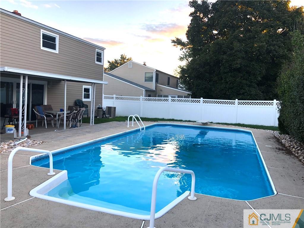 51 Eardley Road Edison, NJ 08817 - Photo 22 of 22 a view of a swimming pool with chairs