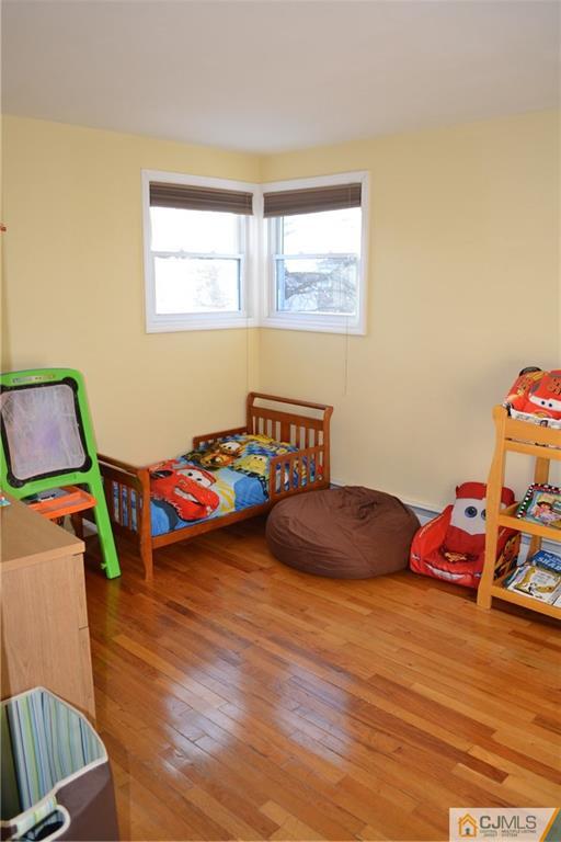 51 Eardley Road Edison, NJ 08817 - Photo 9 of 22 a bedroom with two beds and a window