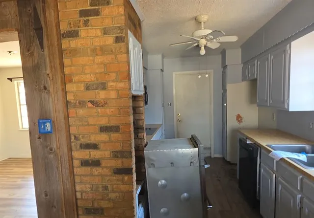 a bathroom with a light fixture a mirror and a shower