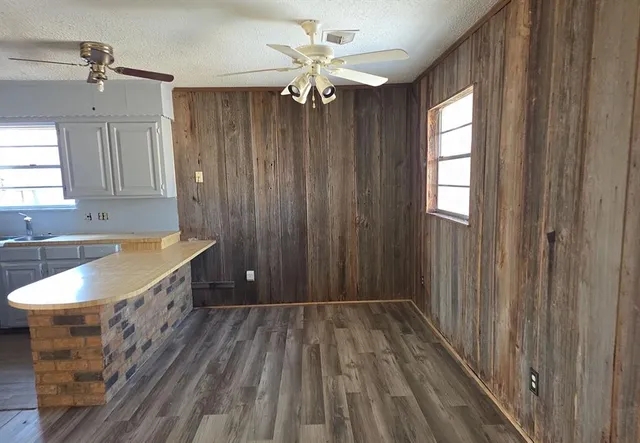 a bathroom with a sink a mirror and a bathtub