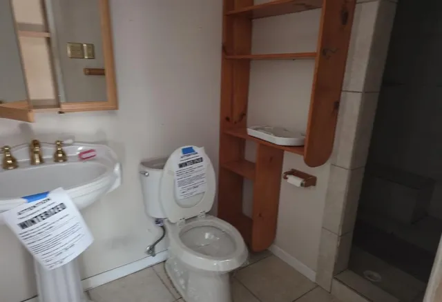a bathroom with a toilet and a sink