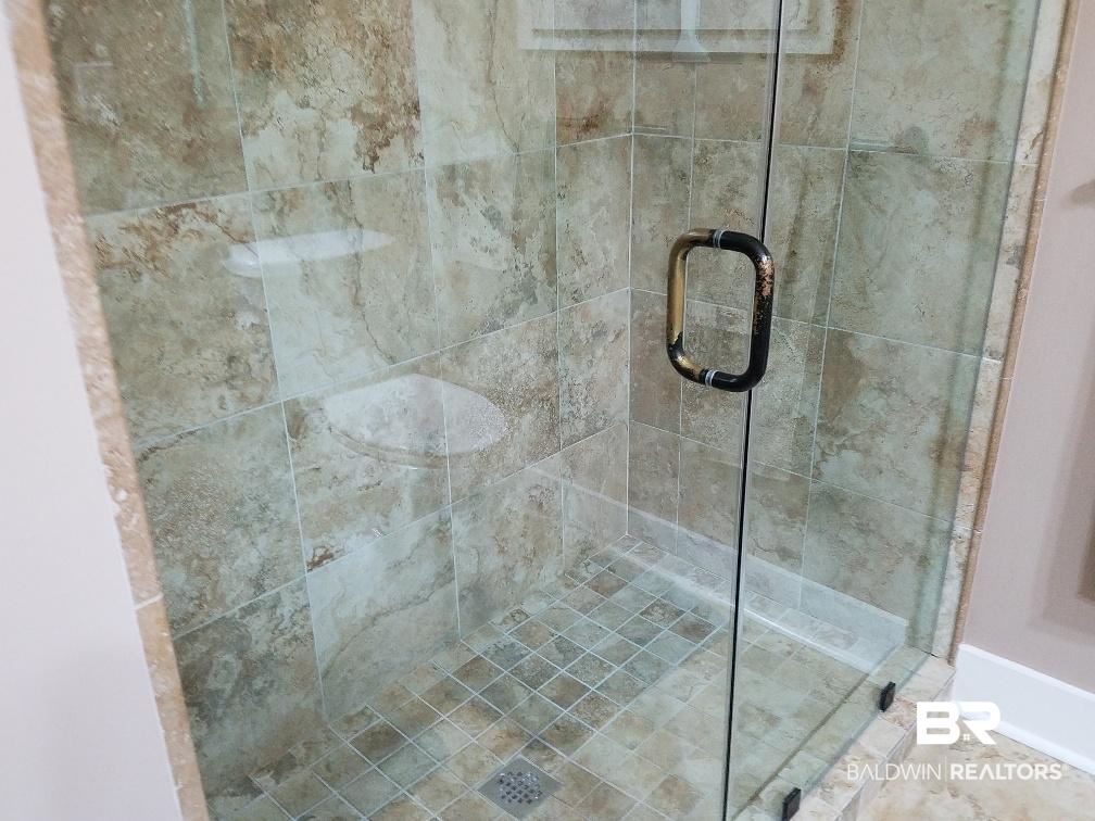 25773 Canal Road, Unit 41 Orange Beach, AL 36561 - Photo 11 of 34 Dramatic Glass shower with tile enclosure