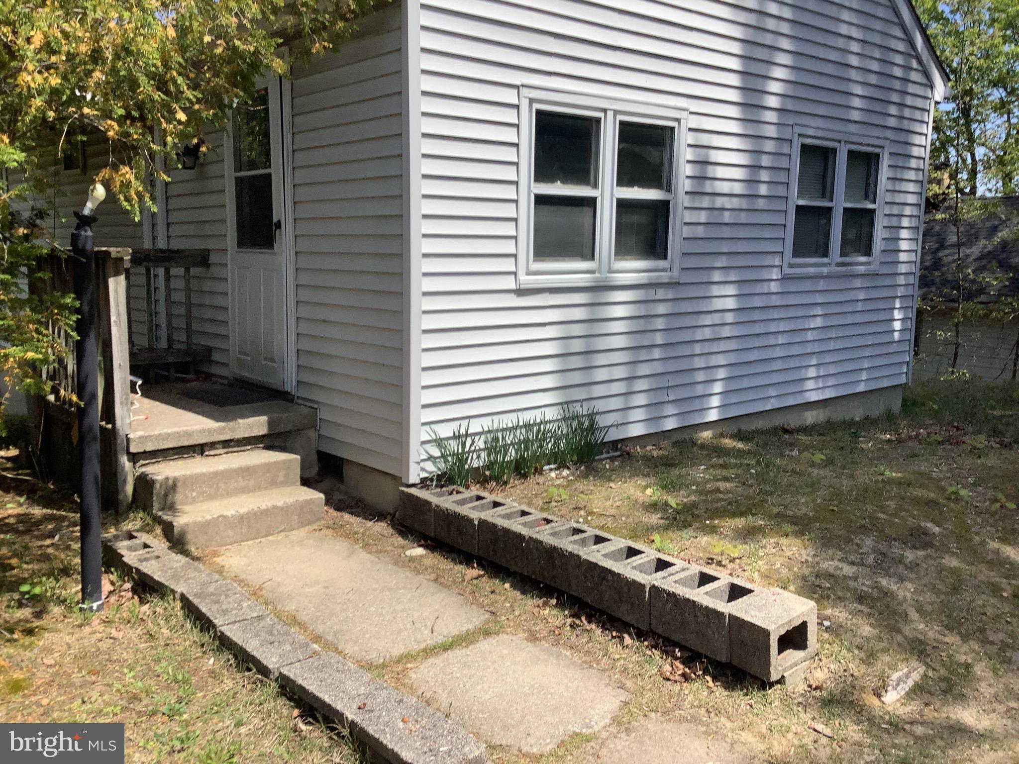 21 Davis Avenue Clementon, NJ 08021 - Photo 3 of 15 a view of a house with a yard and garage