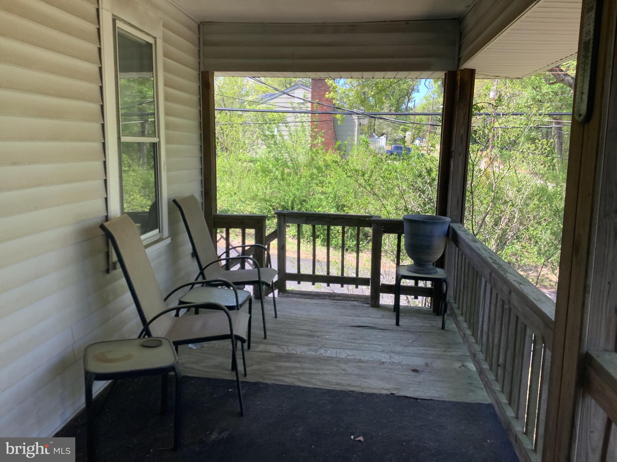 21 Davis Avenue Clementon, NJ 08021 - Photo 4 of 15 a view of a porch with furniture and a yard