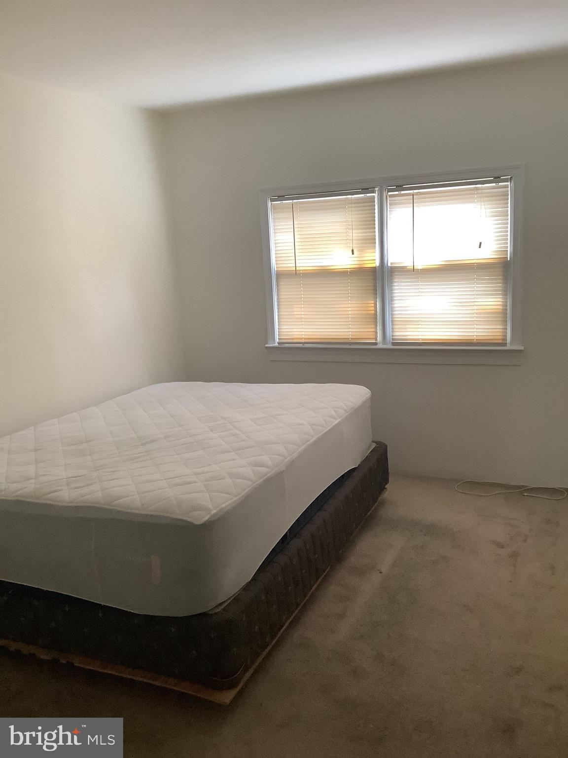 21 Davis Avenue Clementon, NJ 08021 - Photo 8 of 15 a bed sitting in a bedroom next to a window
