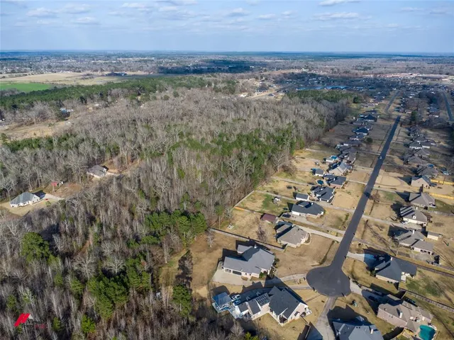 an aerial view of beach and residential building