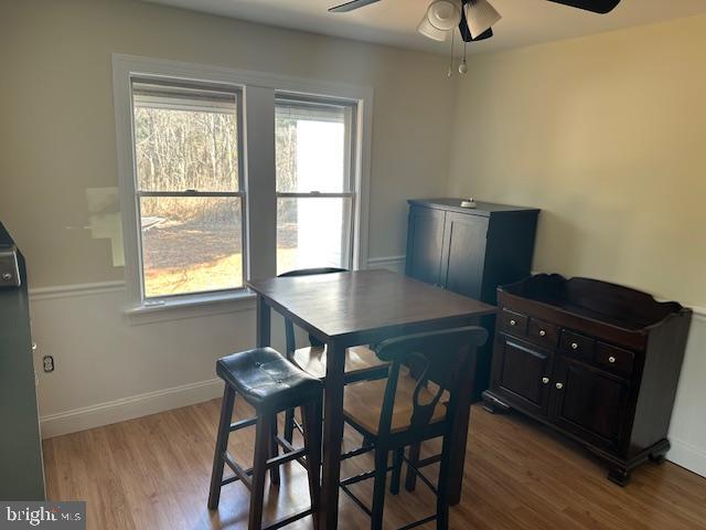10116 Deal Island Road Deal Island, MD 21821 - Photo 10 of 30 a view of a dining room with furniture and wooden floor