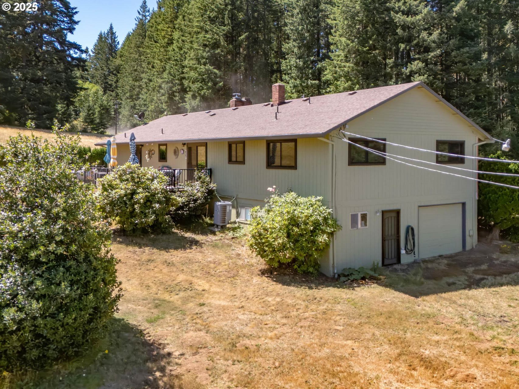 25420 Northwest Pumpkin Ridge Road North Plains, OR 97133 - Photo 22 of 41 a view of a house with garden