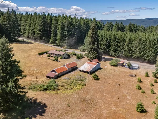 a view of a backyard with sitting area