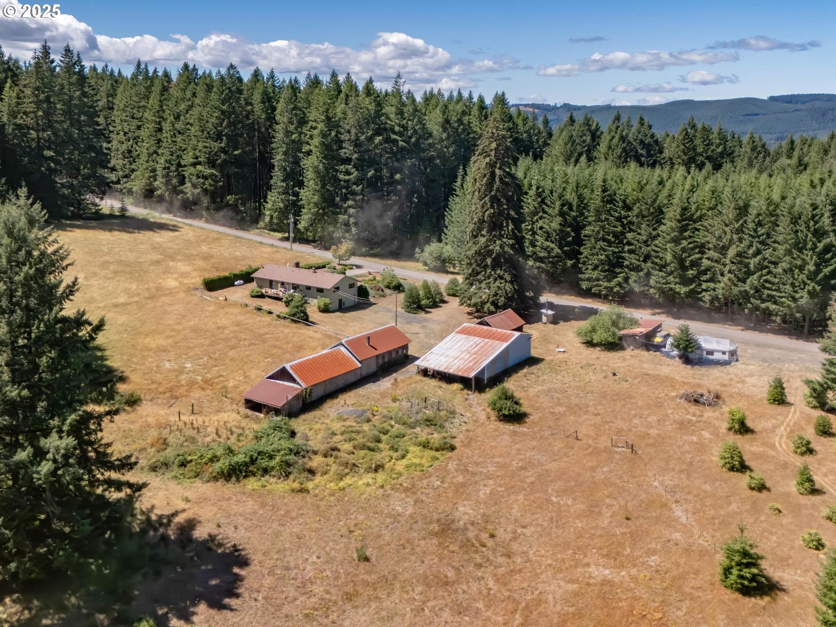 25420 Northwest Pumpkin Ridge Road North Plains, OR 97133 - Photo 28 of 41 a view of a backyard with sitting area