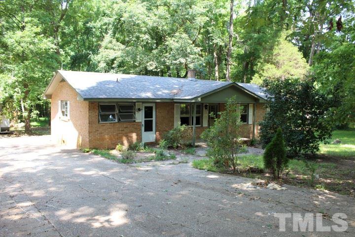 10416 Fanny Brown Road Raleigh, NC 27603 - Photo 1 of 4 a front view of a house with a garden and porch