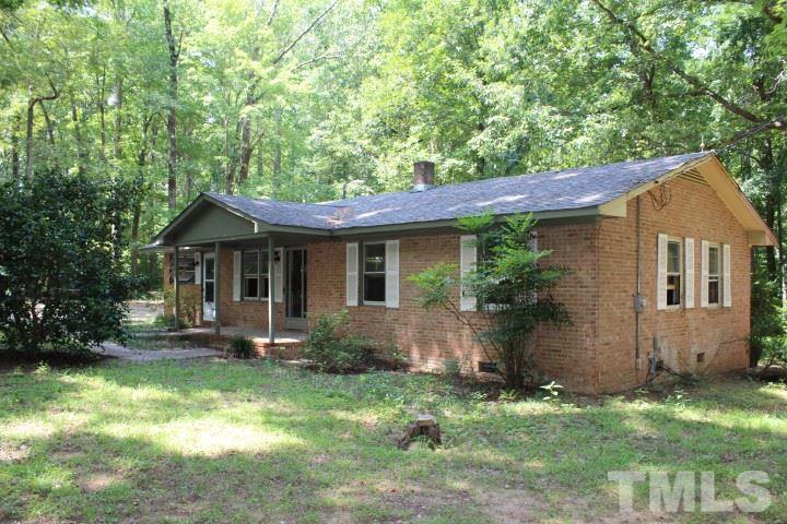 10416 Fanny Brown Road Raleigh, NC 27603 - Photo 2 of 4 a front view of a house with garden