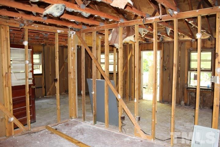 10416 Fanny Brown Road Raleigh, NC 27603 - Photo 3 of 4 a view of an entryway with wooden floor and door