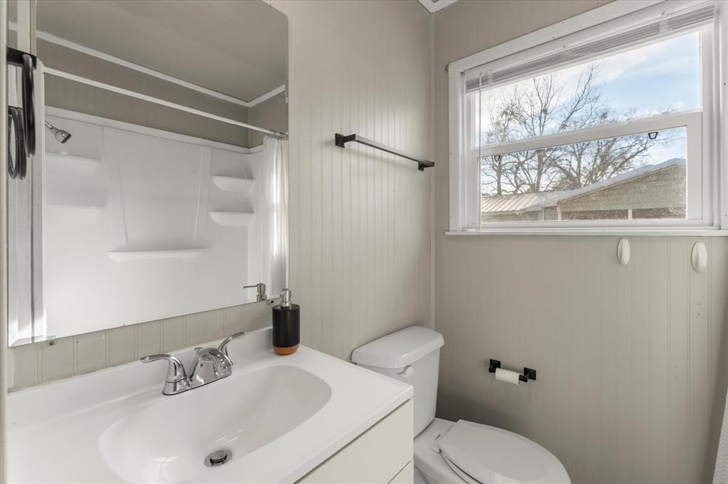 714 Jeanell Street Quitman, TX 75783 - Photo 15 of 20 a bathroom with a sink toilet and shower