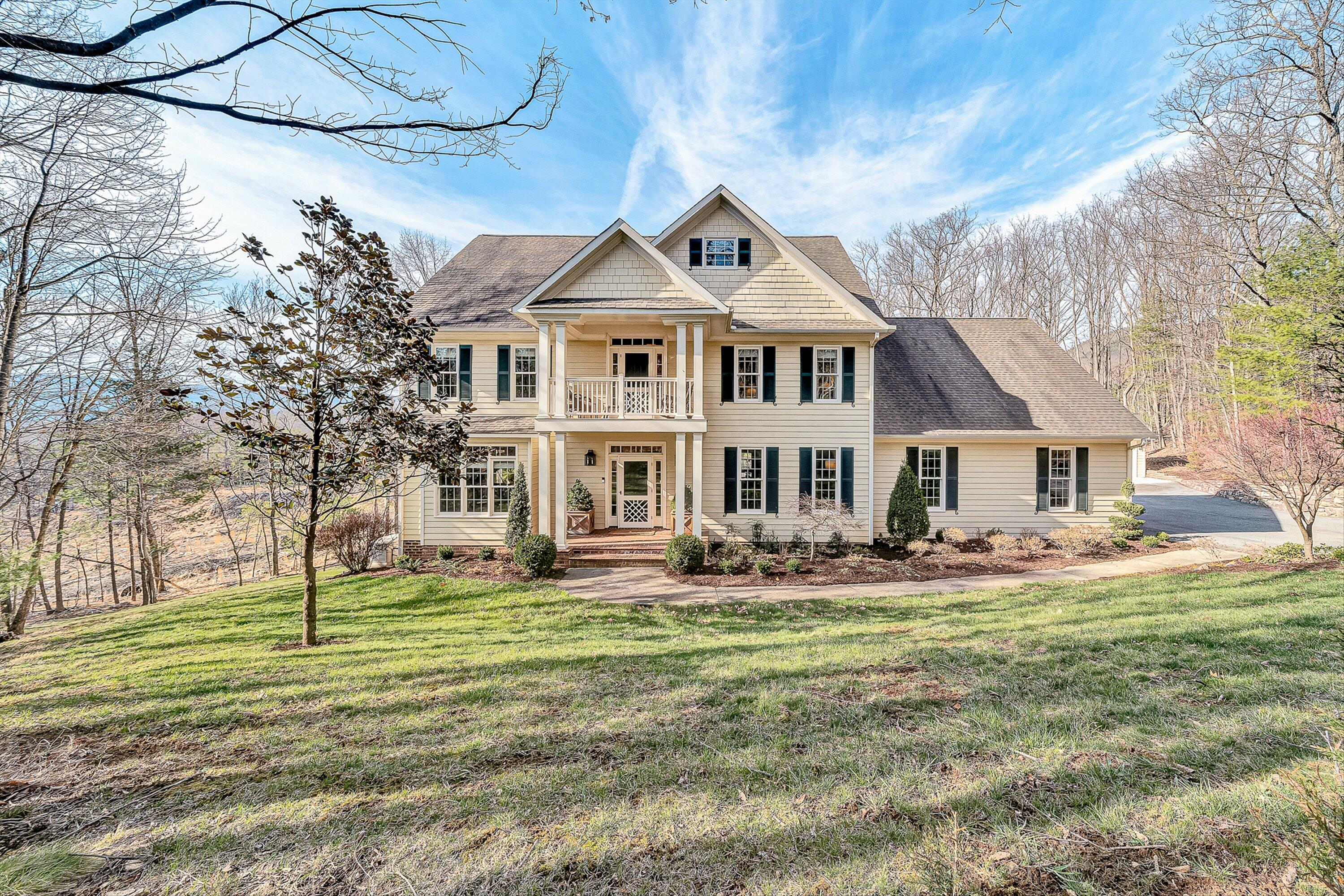 5464 Ridgelea Estates Drive Roanoke, VA 24018 - Photo 2 of 85 a front view of a house with a garden