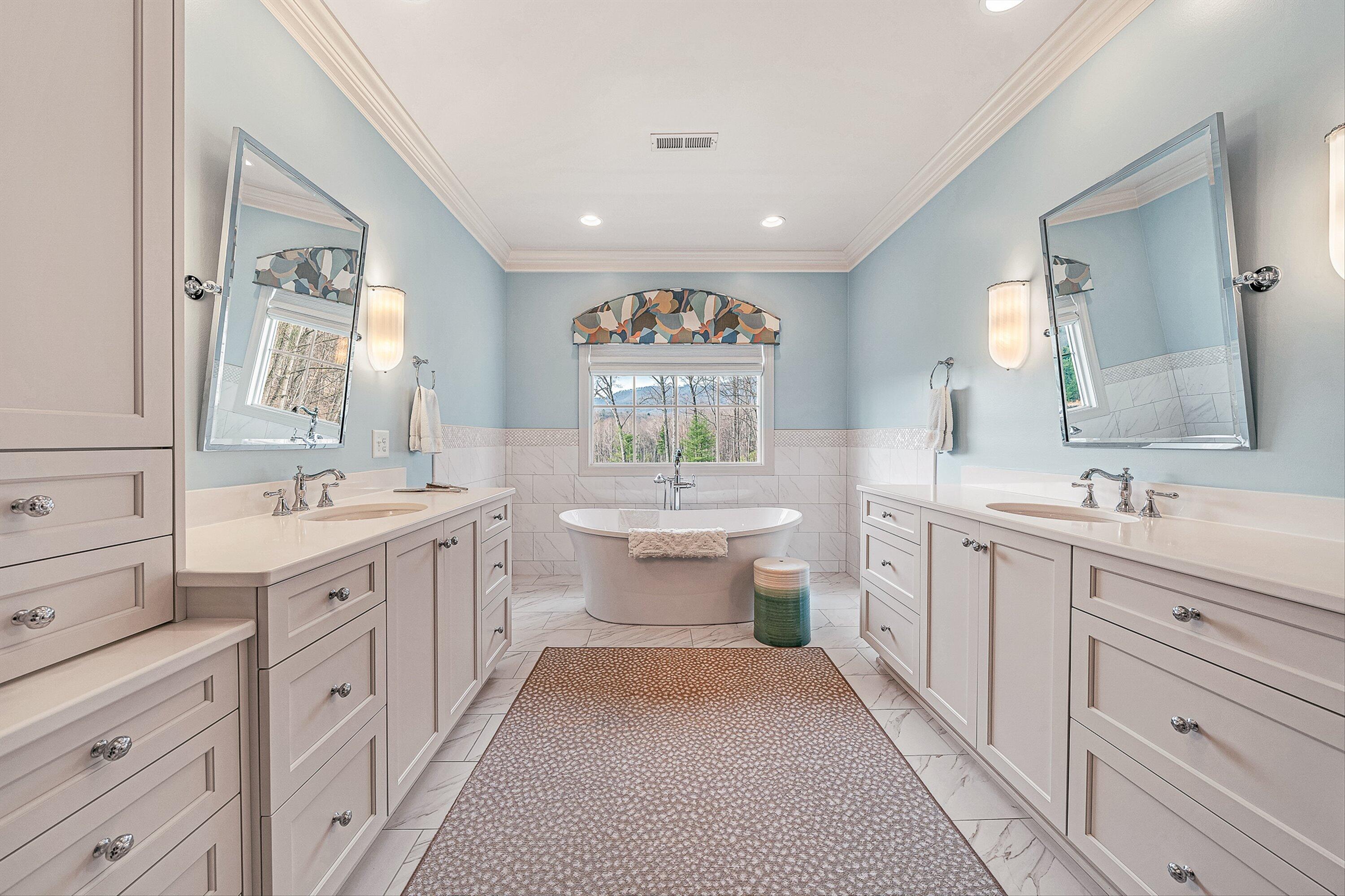 5464 Ridgelea Estates Drive Roanoke, VA 24018 - Photo 48 of 85 a spacious bathroom with a double vanity sink a mirror a window and a bathtub