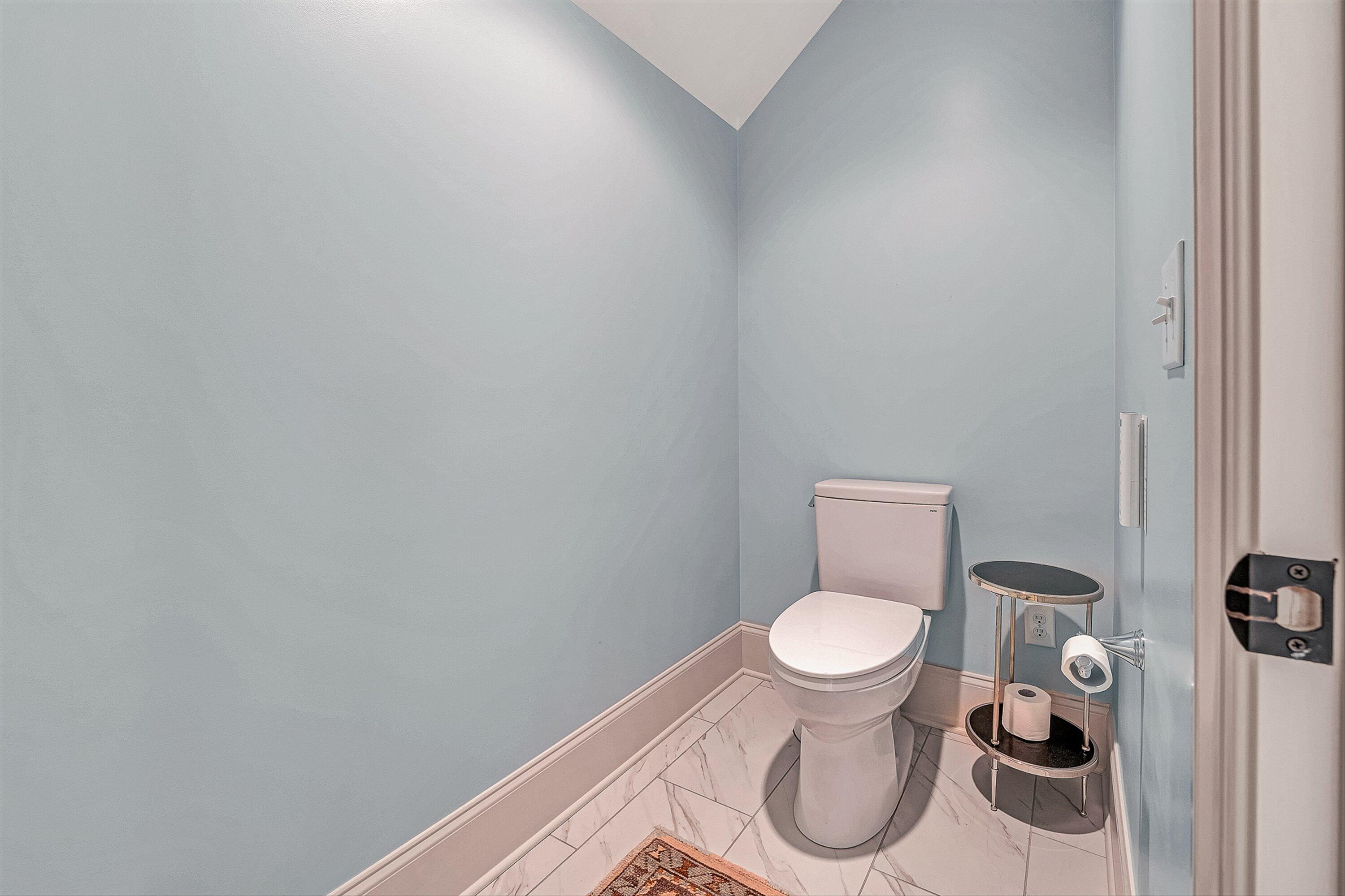 5464 Ridgelea Estates Drive Roanoke, VA 24018 - Photo 51 of 85 a white toilet sitting in a bathroom and a sink