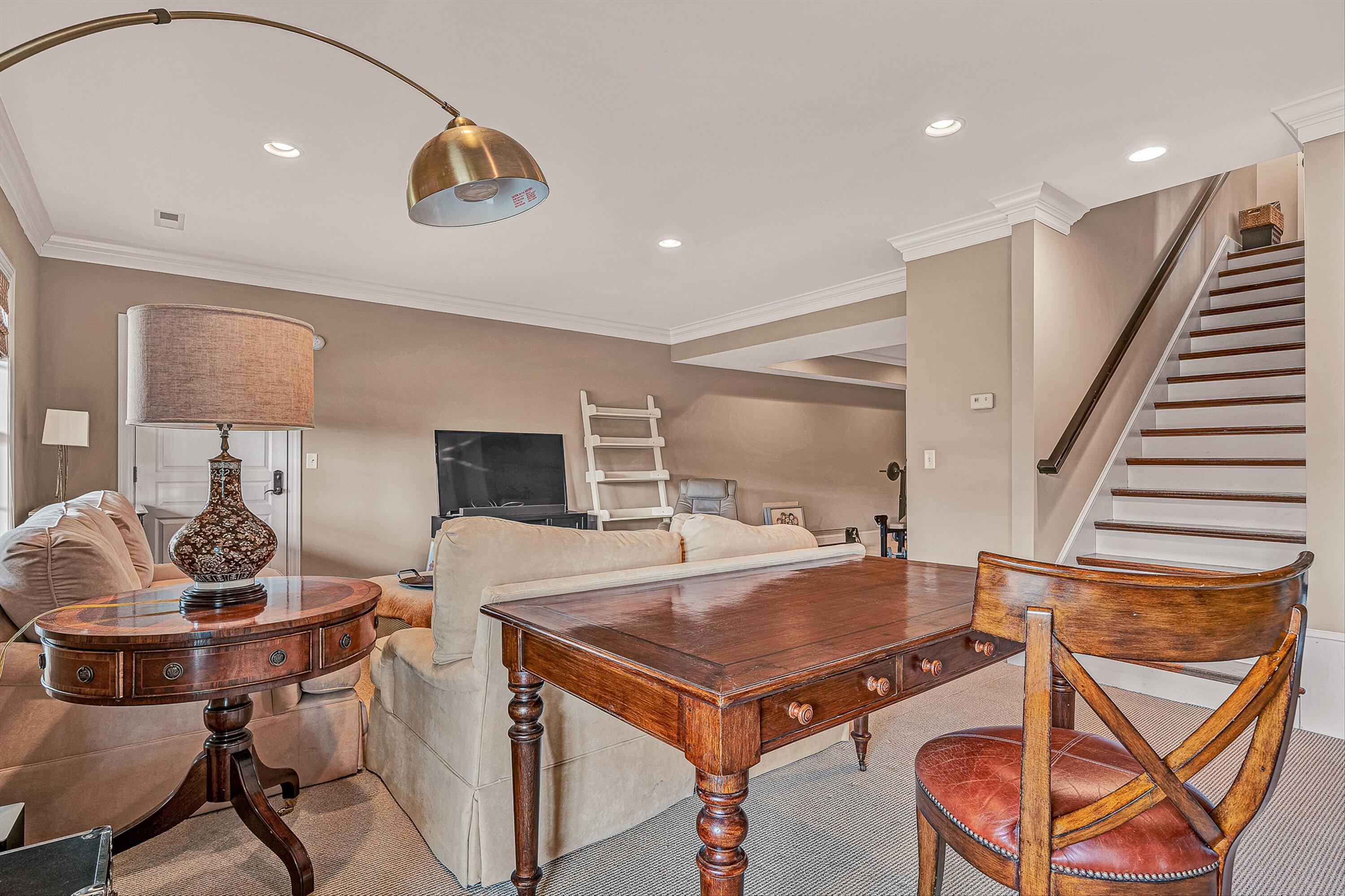 5464 Ridgelea Estates Drive Roanoke, VA 24018 - Photo 65 of 85 a living room with a table chairs and a wooden floor