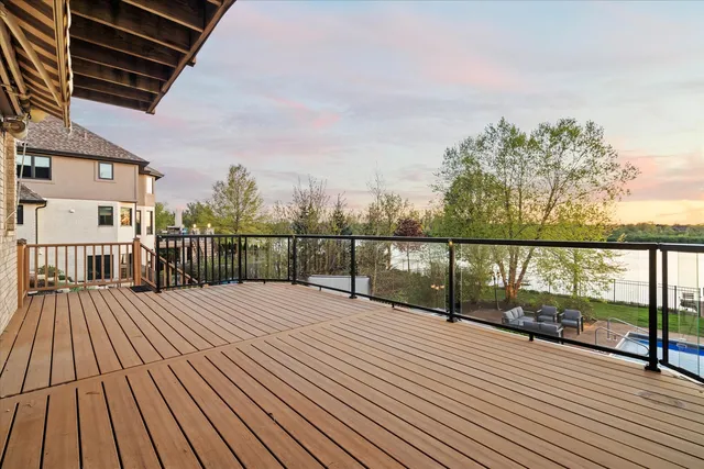an aerial view of residential houses with outdoor space and street view