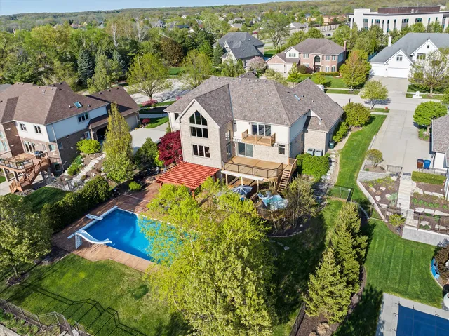 a view of a patio with couches under an umbrella