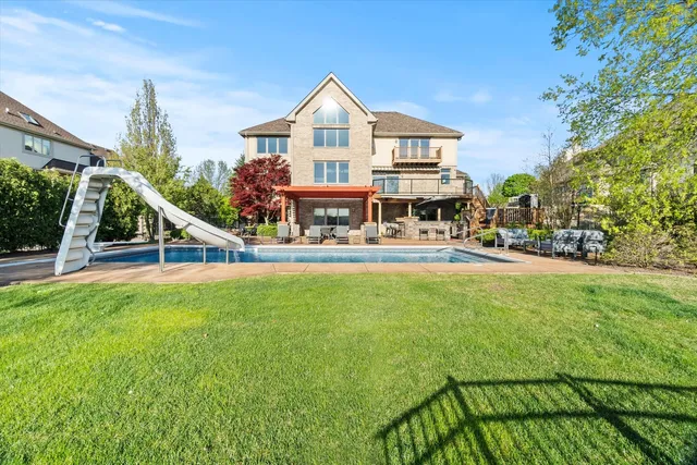 a view of a balcony with wooden floor and fence