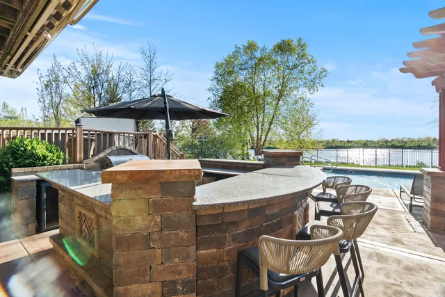 a open kitchen with stainless steel appliances granite countertop lots of counter top space and cabinets