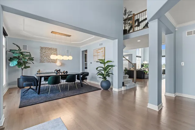 a kitchen with white cabinets and refrigerator