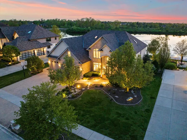 an aerial view of residential houses with outdoor space and street view