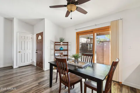 a kitchen with sink refrigerator and large window