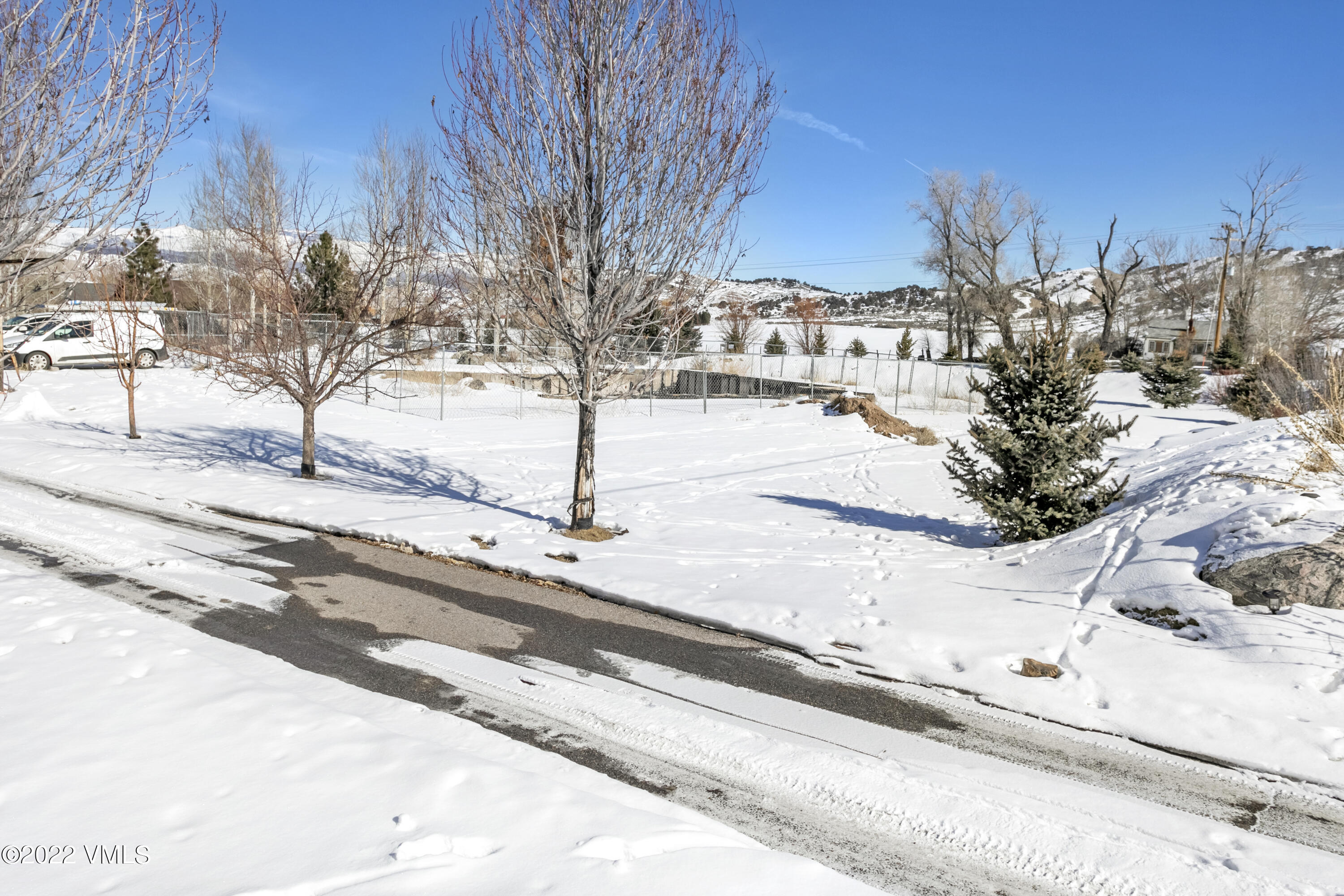 50 Cottonwood Pass Road Gypsum, CO 81637 - Photo 21 of 33 a view of a yard with snow on the road