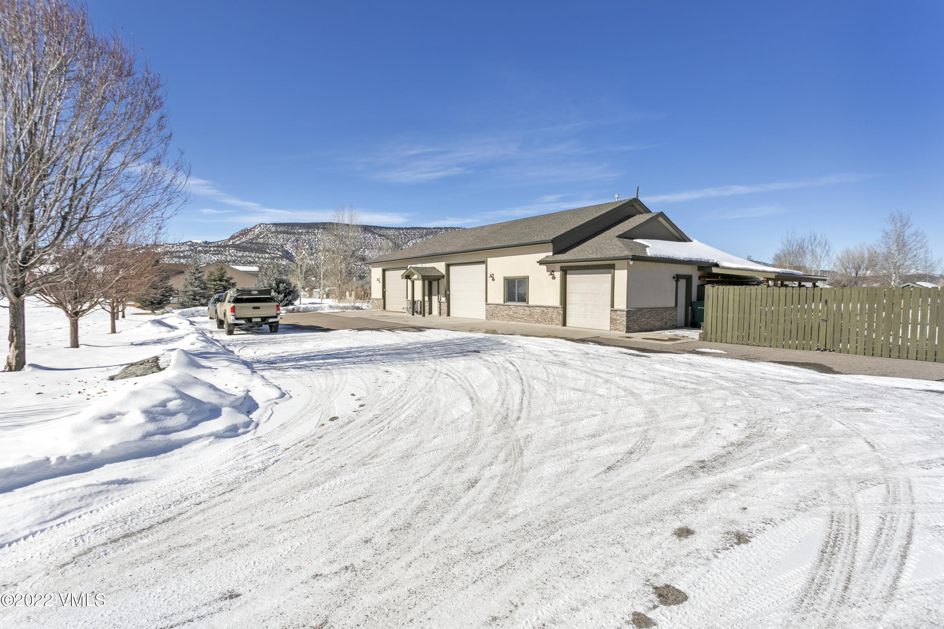 50 Cottonwood Pass Road Gypsum, CO 81637 - Photo 4 of 33 a view of a house with a yard covered in snow
