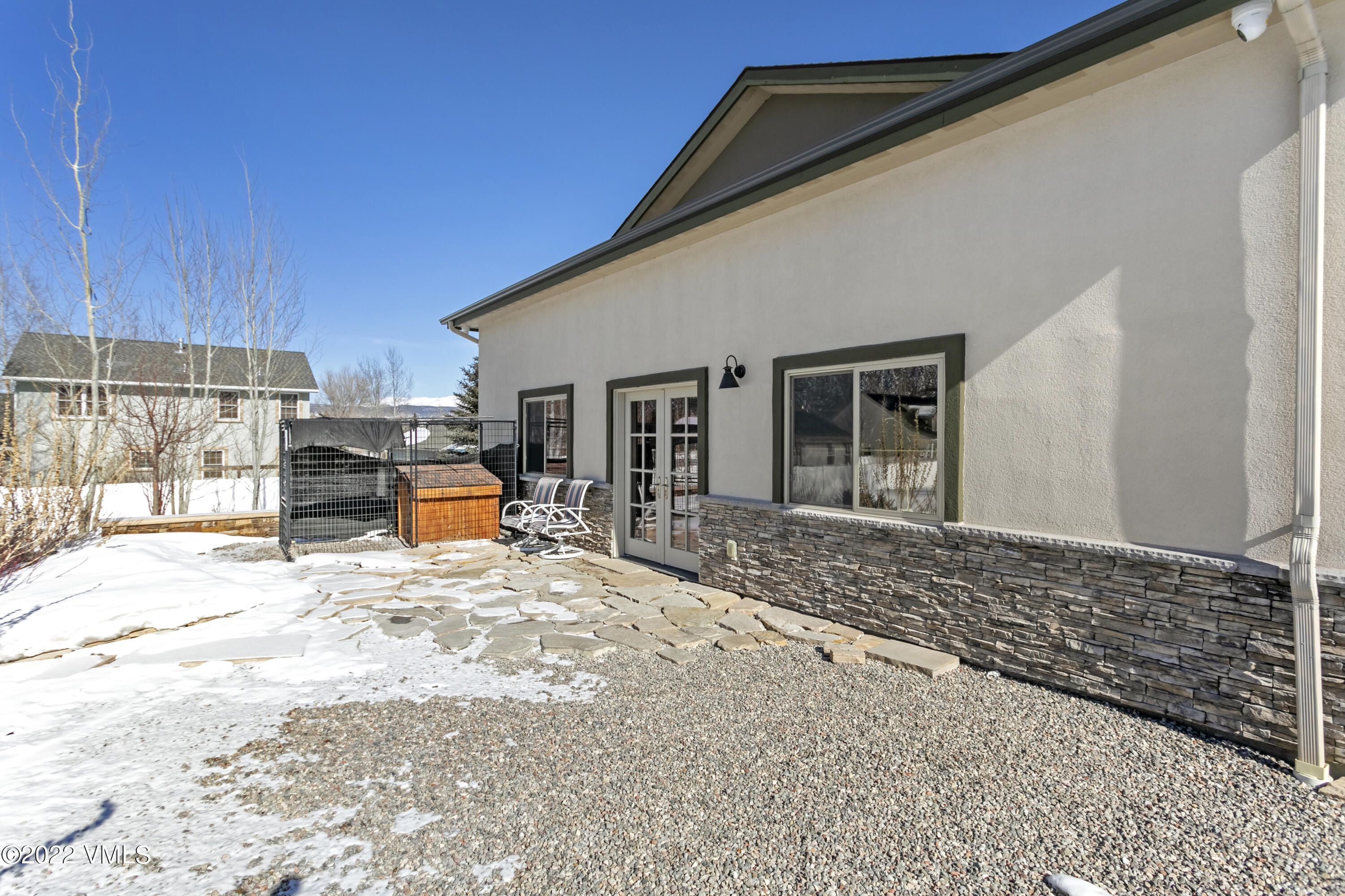 50 Cottonwood Pass Road Gypsum, CO 81637 - Photo 5 of 33 a backyard of a house with barbeque oven table and chairs