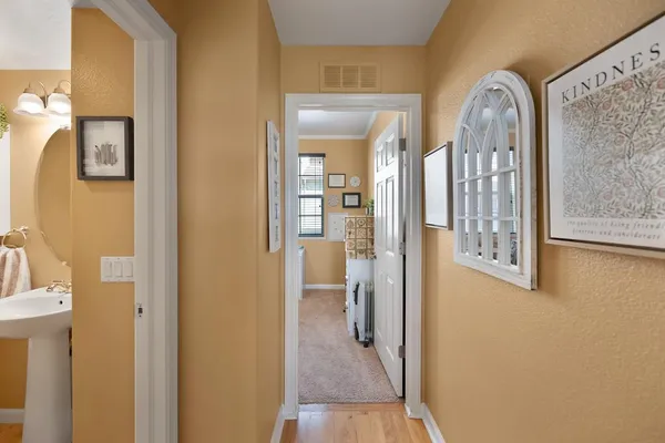 a view of a bathroom from a hallway