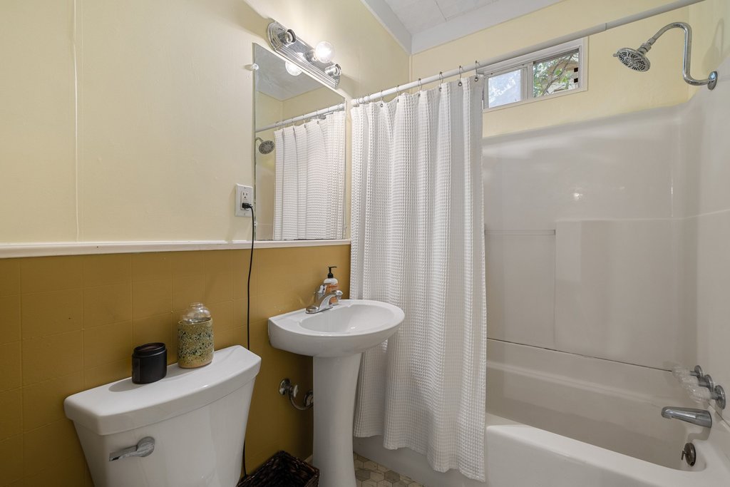 807 Cecelia Street Taylor, TX 76574 - Photo 17 of 24 a bathroom with a sink a toilet and shower