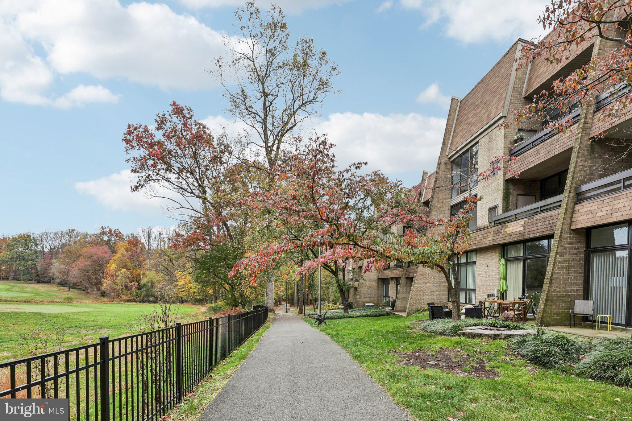 2118 Green Watch Way, Unit 10/201C Reston, VA 20191 - Photo 28 of 30 a view of a building with a yard