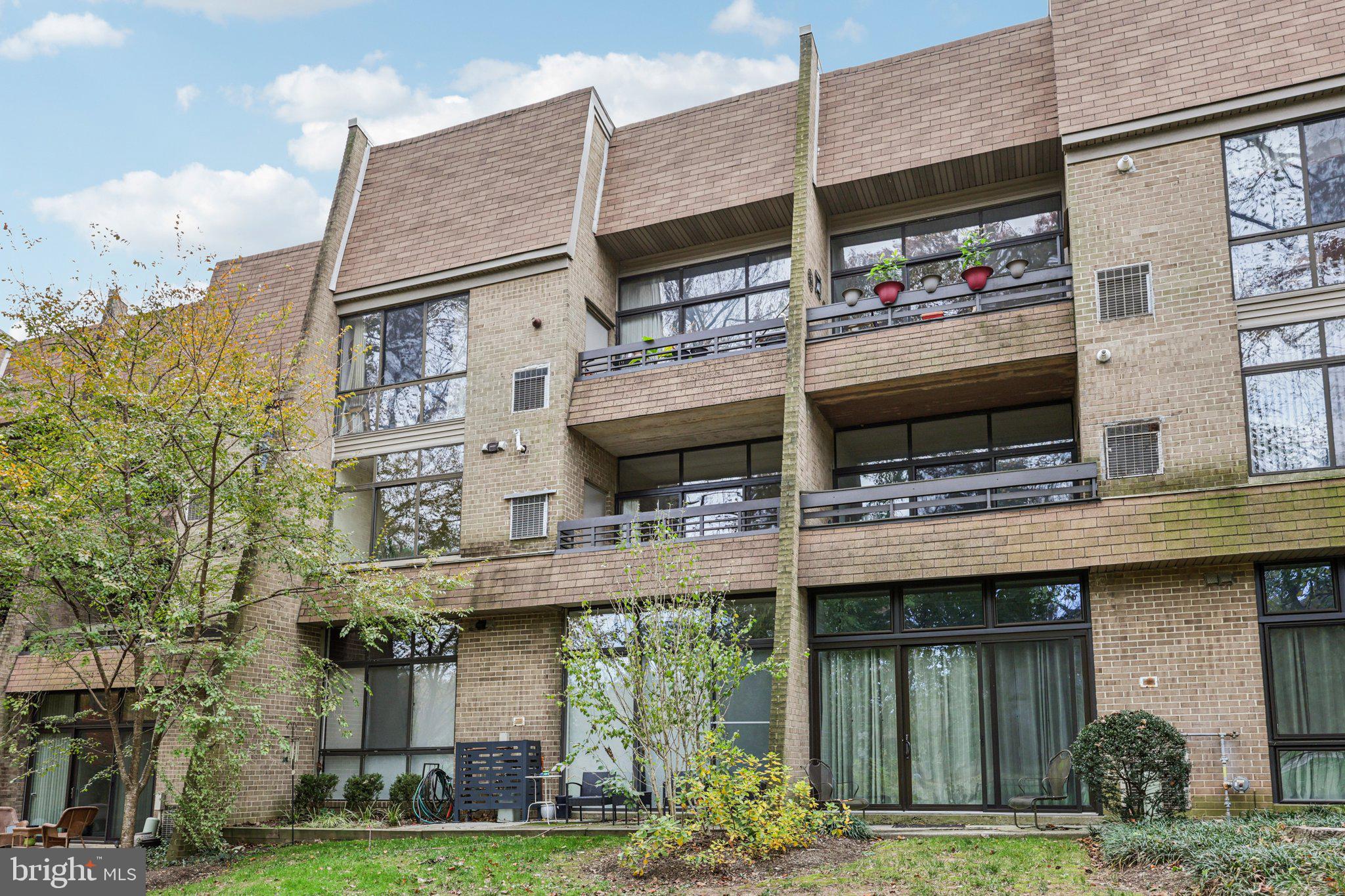 2118 Green Watch Way, Unit 10/201C Reston, VA 20191 - Photo 30 of 30 a view of a building with a garden and plants